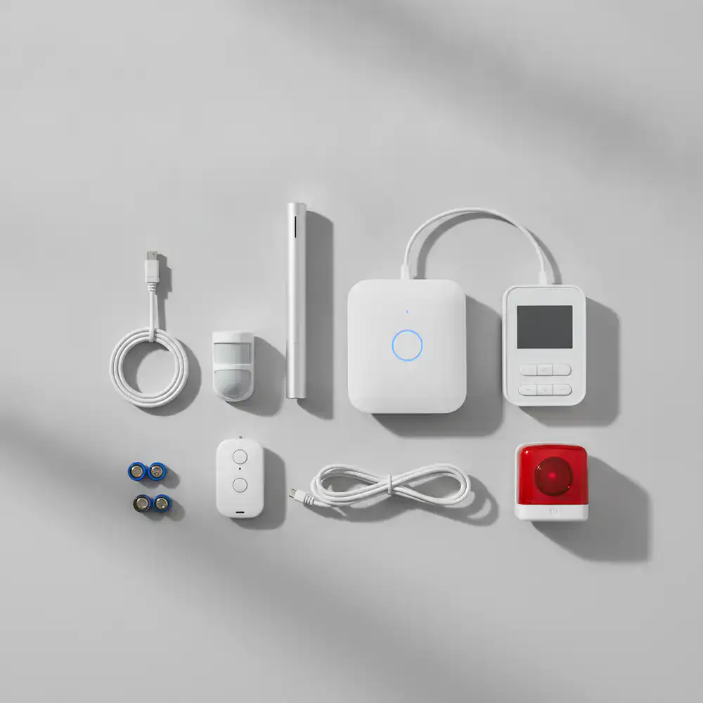 Komponenty systemu alarmowego rozłożone na płasko